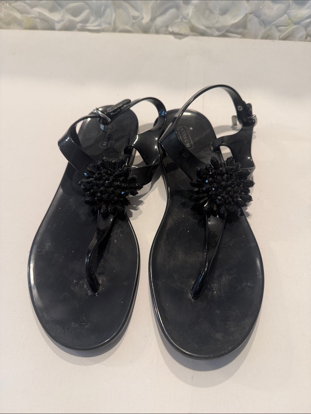 Coach Black Jelly Thong Sandals with Jeweled Floral Appliqué